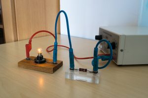 Electrical Experiment In Physics Laboratory. Electrical Circuit With Resistance And Light Bulb.