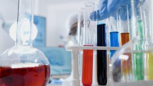 Scientist Specialist Doctor With Ppe Equipment Working With Medical Transparent Test Tubes